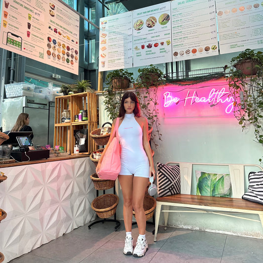 honeydew lounge girl wearing high neck backless onesie playsuit