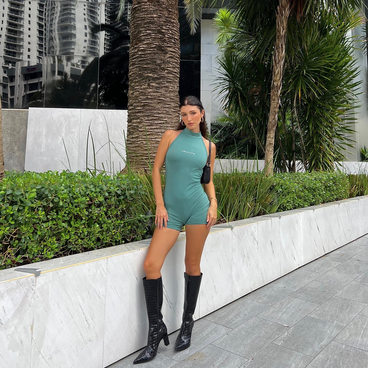 honeydew lounge girl wearing fitted high neck backless onesie