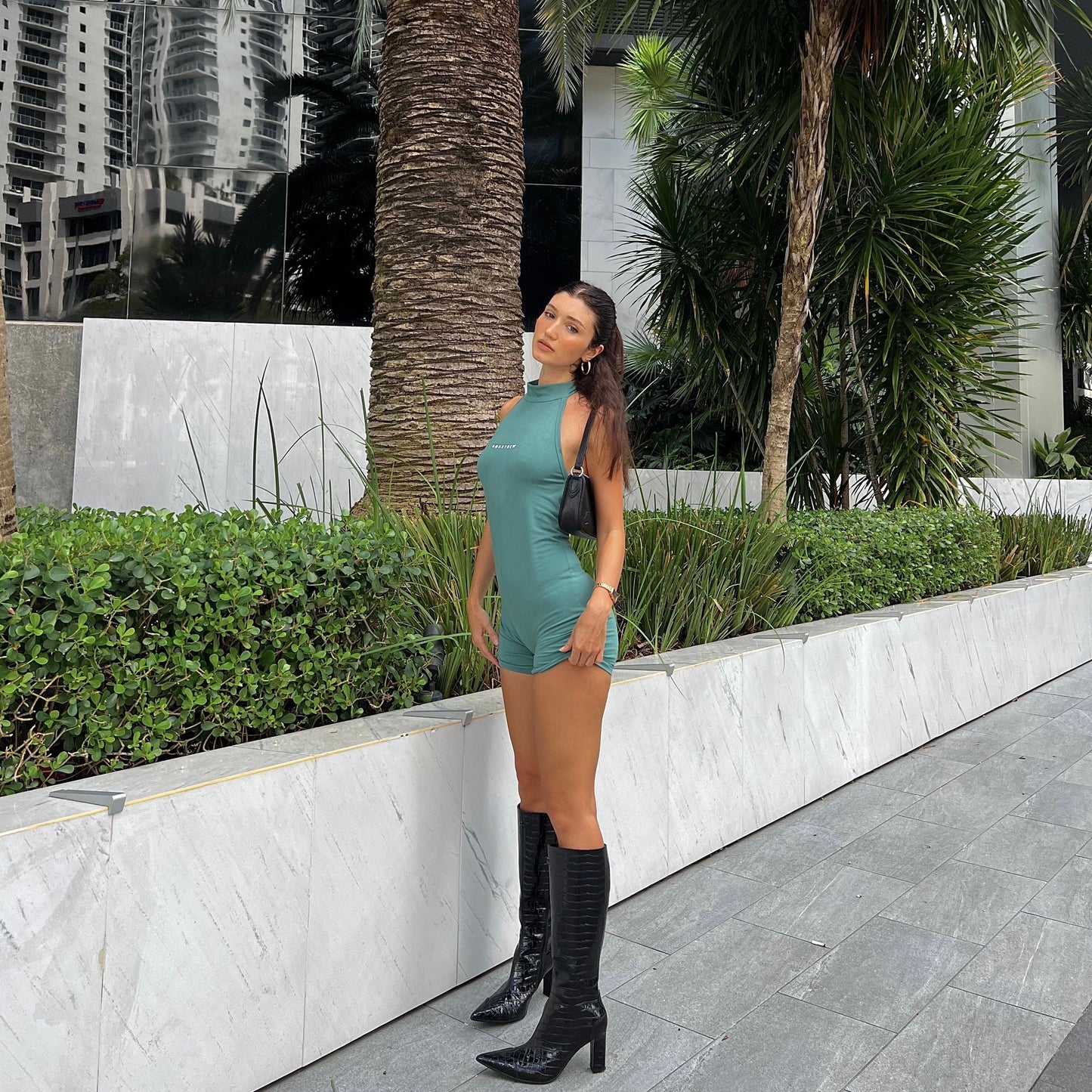 honeydew lounge girl wearing fitted high neck backless onesie